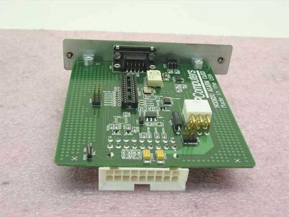 GNP Computers NODE2U Alarm Card 1-503012 — PCB top view showing Molex power connector, ICs, and rear DB9 port