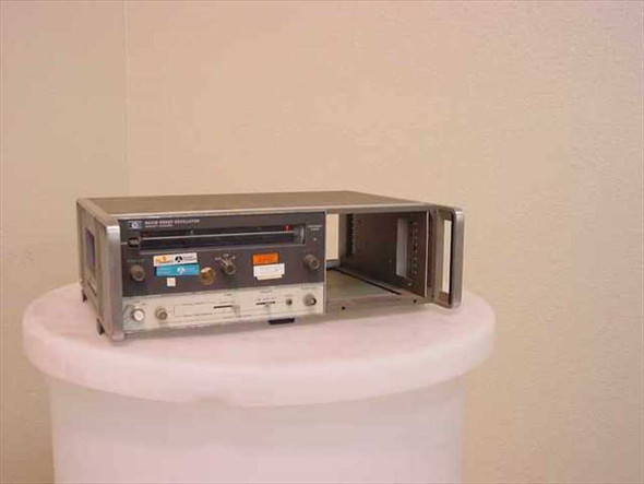 HP 8620B Sweep Oscillator Mainframe right-side three-quarter view showing installed plug-in and empty plug-in slot
