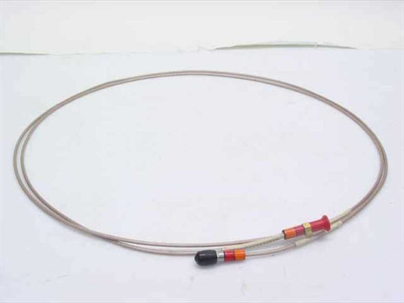 Times Microwave SMA Male to Female coaxial cable coiled full length view showing beige jacket and color-coded connector bands