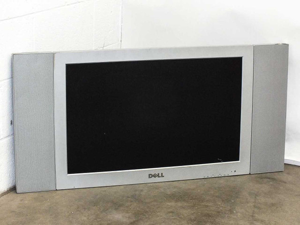 Dell W3000 30-inch LCD TV and monitor — front view showing screen and integrated side speakers, leaning against wall