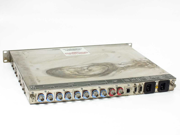 ARG 1900 1945-EQTW1-BOM T3/DS3 ASI Media Combiner Transmitter — front panel view showing blue LCD display and navigation buttons with FAIL, ALARM, and POWER indicators; top cover shows significant discoloration and residue staining