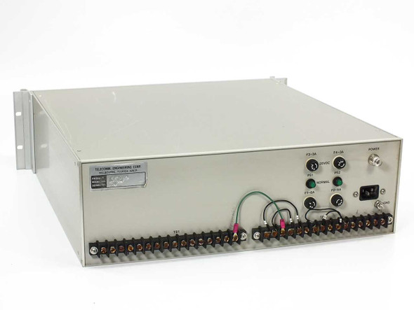Telecomm Engineering 142001-1 Network Mimic Panel – rear panel showing IEC AC power inlet, 28VDC label, PS1/PS2 power supply indicators, fuse holders F1–F4, NORMAL status LED, terminal blocks TB1 and TB2, and GND lug