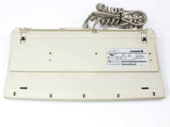 Cherry G81-7000LABUS/12 MY 7000 keyboard — bottom view showing regulatory label and coiled AT cable