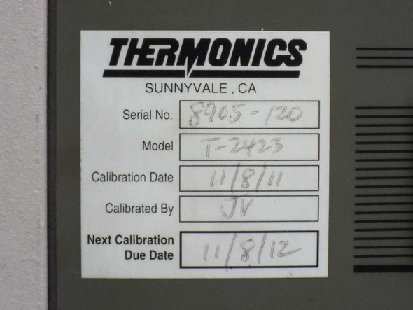 Thermonics T-2423 Precision Temperature Forcing System main console on casters with two T-ADF arm assemblies detached and lying on the floor in front