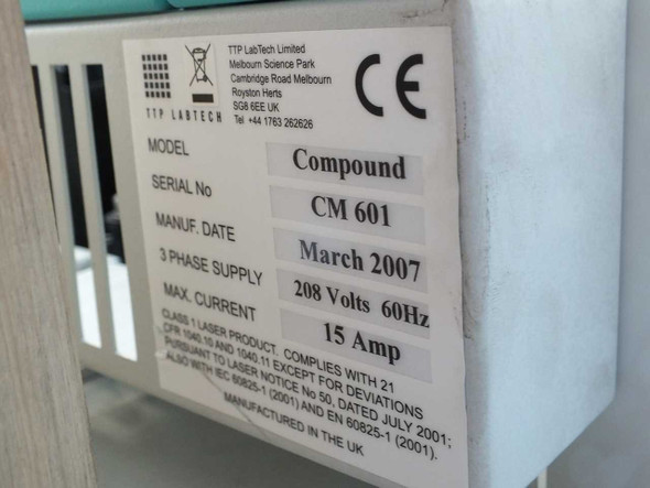 TTP Labtech comPOUND CM601 rating plate showing model CM601, serial CM601, manufacture date March 2007, 208V 60Hz 15A 3-phase supply, Class 1 laser product