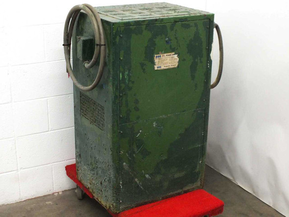 HBS L5006 DC Electroplating Power Supply – right-side front view showing heavily worn green cabinet on dolly with coiled cable on top