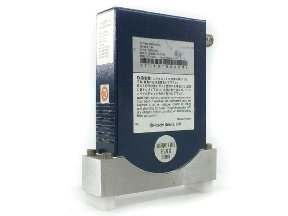 Aera PI-98 PI-980 MFC rear label showing Hitachi Metals branding, part number, and caution text