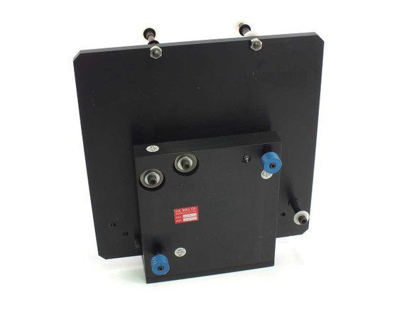 JA Noll 31094 NCM-10 optical mirror mount rear view showing mounting base block with adjustment screws and blue locking knobs attached to back of main plate