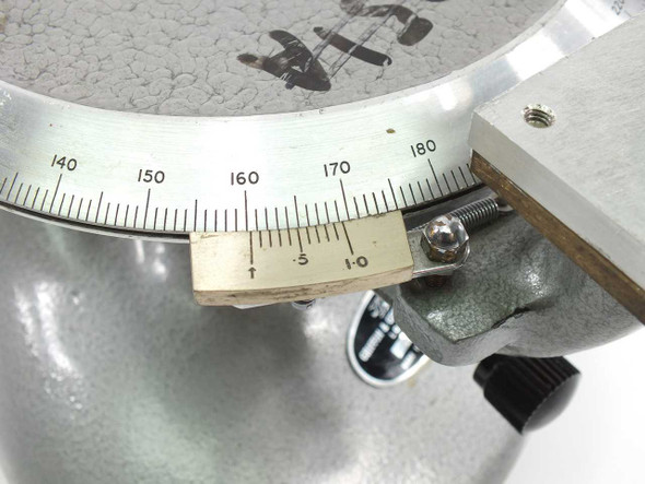 Close-up of the divided circle vernier scale on Griffin & George rotary measuring stage showing degree graduations 140–180 and vernier subinterval markings