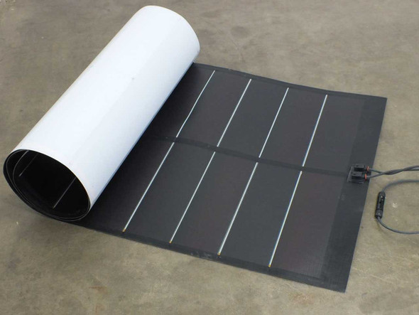 Xunlight XSD38-123 123W flexible amorphous solar panel partially rolled up, showing white backing and dark cell surface with MC4-compatible output cable