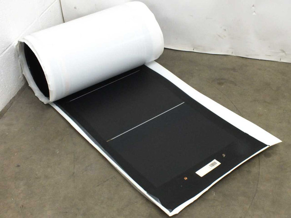 Xunlight XUS10-71 flexible solar panel partially unrolled showing front solar cell surface and rolled end