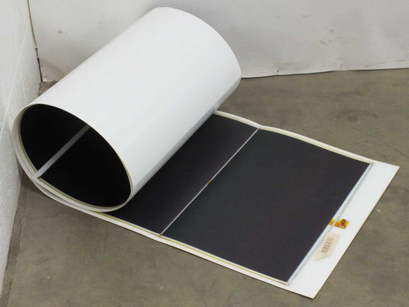 Xunlight XRS8-66 66W flexible amorphous solar panel partially unrolled on floor showing black cell array and white backing