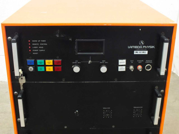 Lambda Physik EMG 102 MSC front panel close-up showing status indicator lights, digital display, HV Level and Rep Rate controls, and model label