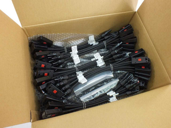 Onamba PVU-B48-022 MC4 solar junction box sets — full carton of 50 pairs packed in open cardboard shipping box