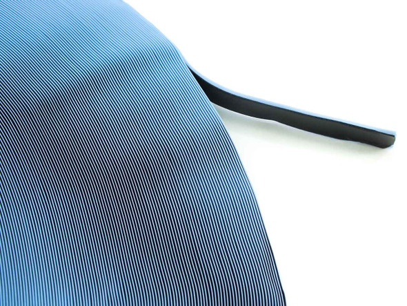 Quanex Solargain butyl edge tape roll close-up showing blue release liner and black butyl edge