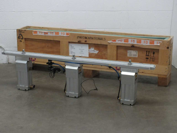 VAT X-VAT100-40496 air actuated vacuum valve assembly 56 inches long shown with original shipping crate, three actuator legs visible, front view