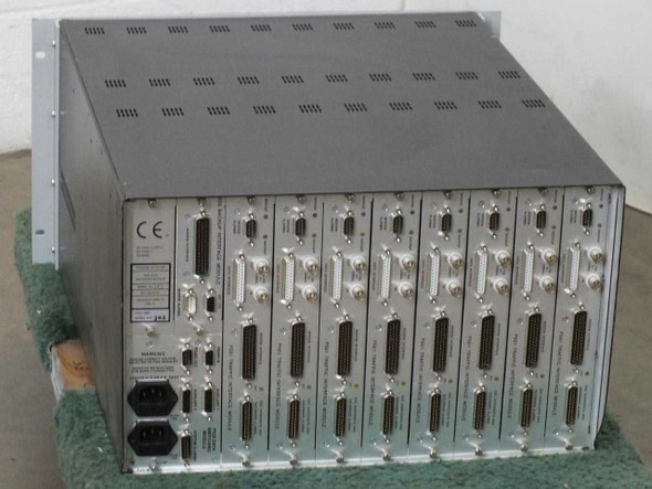 Paradise Datacom P500 rear panel showing eight P551 Traffic Interface Modules with multi-pin connectors and CE marking label