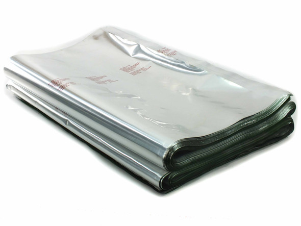 Cadpak HD100 MIL-PRF-131K foil barrier vacuum seal bags stacked in a bundle, showing silver exterior and green-edged sealant layer