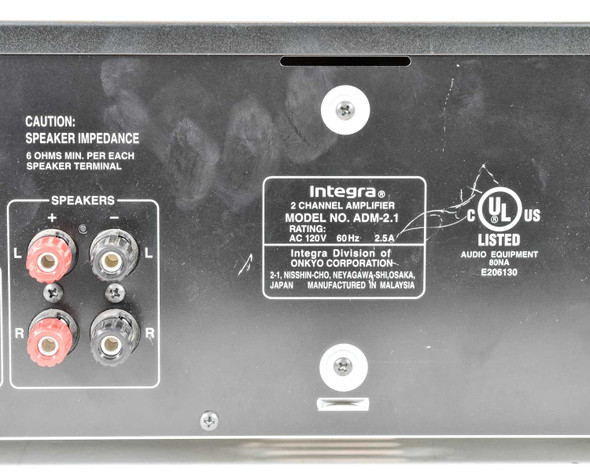 Integra ADM-2.1 rear panel close-up showing speaker binding posts, rating label (AC 120V 60Hz 2.5A), UL listing, and Onkyo/Malaysia manufacture info