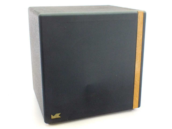 Miller & Kreisel V-3B Volkswoofer III subwoofer front view showing black fabric grille and wood side accent with MK logo
