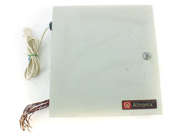 Altronix ALTV1224DC2 CCTV power supply — front view of BC300 metal enclosure, door closed, with AC power cord and output wire leads visible