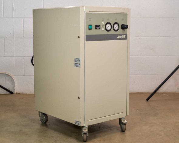 Jun-Air 2000-25M oil-free cabinet air compressor – three-quarter front-right view showing full cabinet profile and caster base