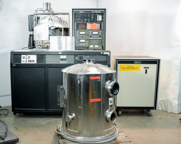 CHA Industries SEC-600 vacuum deposition system overview — bell jar in foreground on pallet, main cabinet and power unit in background