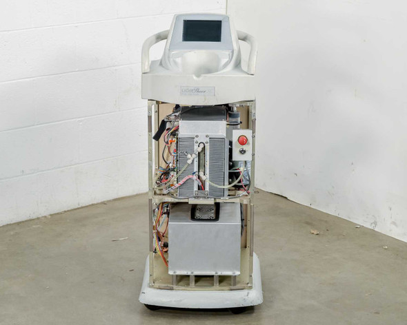 Lumenis LightSheer XC laser system – front view showing open chassis, internal boards, red emergency stop button, and touchscreen display