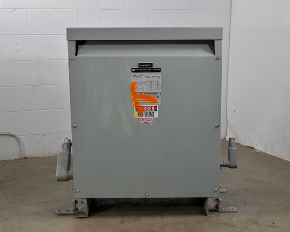 MGM Transformer AD370 75 KVA dry-type transformer – front left view showing enclosure and high-voltage warning label
