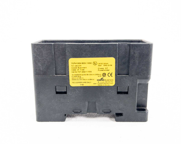 Cooper Bussmann TCFH100N 600V 100A fuse holder – front face view showing yellow label with full specifications and Cooper Bussmann branding