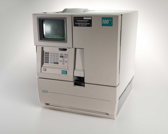Nova Biomedical BioProfile 100 Plus analyzer – three-quarter front-left view showing CRT display, keypad, printer, and sample access door