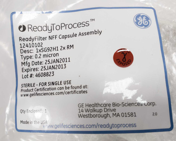 GE ReadyToProcess ReadyFilter NFF Capsule Assembly label showing part number 12410102, 0.2 micron, MFG date 25JAN2011, expiry 25JAN2013, lot 4608823, sterile single-use