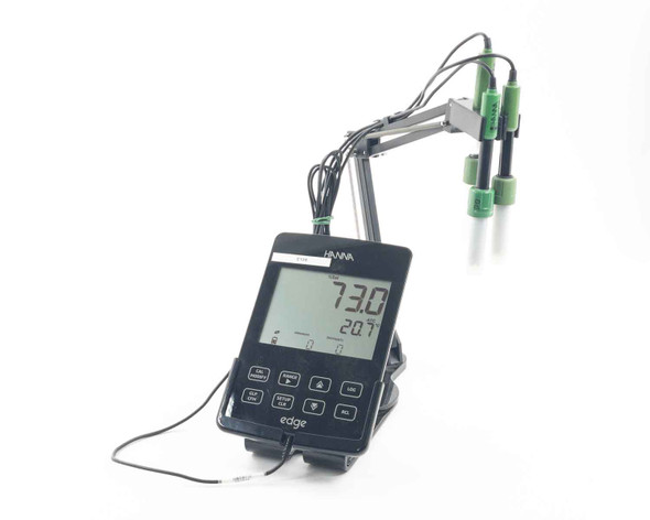 Hanna HI2040-01 edge multiparameter pH and DO meter on benchtop cradle with three probes mounted on swivel arm, LCD displaying 73.0 and 20.7