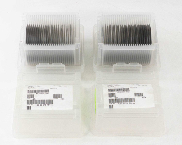 SEH America 100mm silicon wafer lot — four wafer carrier cassettes with label barcodes visible, top-down view