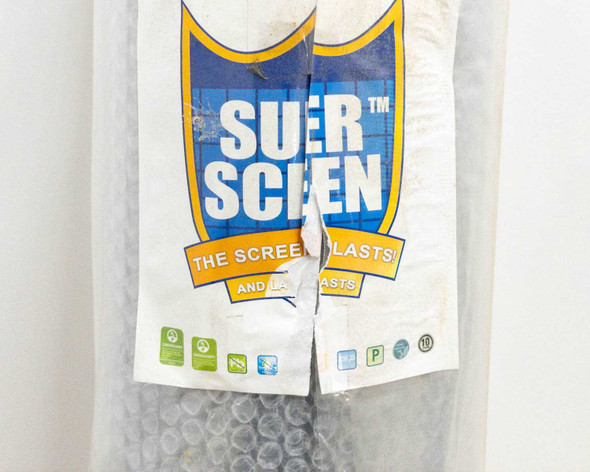 Super Screen brand label on plastic packaging showing 'The Screen That Lasts' – close-up of product label