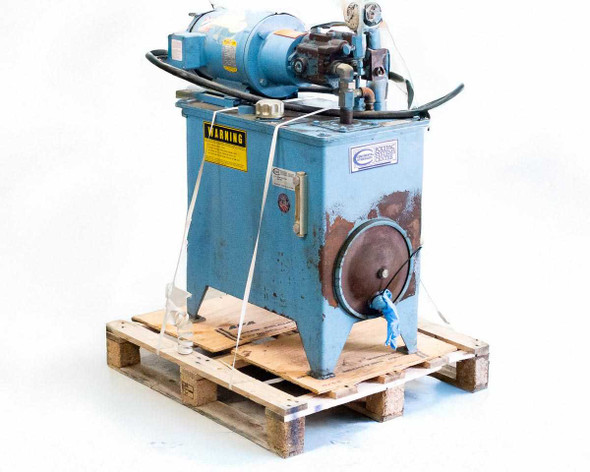 Continental Hydraulics HPV-6B35-RF-0-1F-B hydraulic power unit — 3/4 front-left view on wood pallet showing blue reservoir tank, Baldor motor on top, and warning label