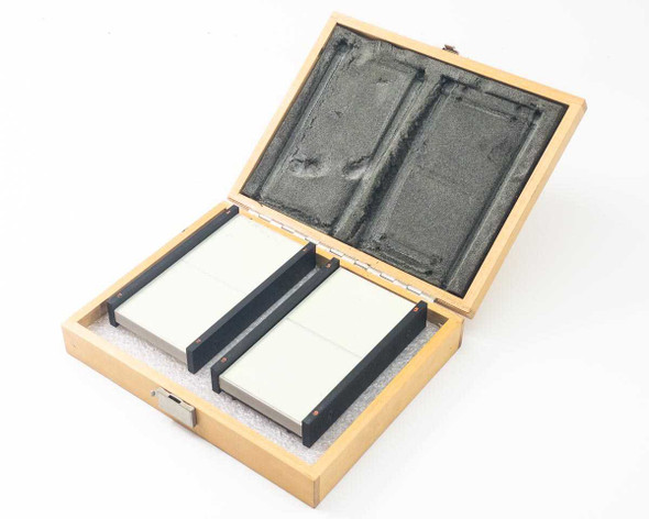 Optical Engineering laser beam dump set — two absorptive panels seated in open wooden carry case with foam lining