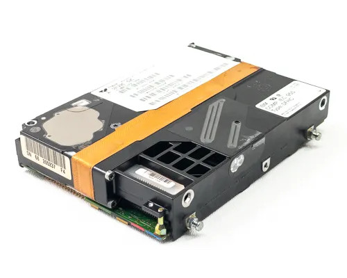 IBM 99F7832 SAA hard drive – side angle view showing enclosure frame, orange ribbon cable, and barcode label