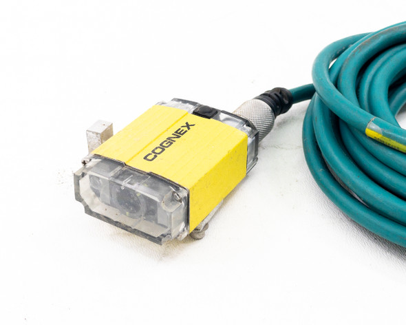 Cognex 821-0025-2R scanner head close-up showing yellow housing, dual lens window, and M12 cable connector
