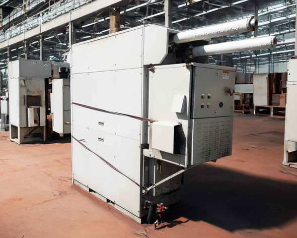 Capstone C65 microturbine generator shown outdoors in industrial setting – front and right-side view with exhaust ducting visible