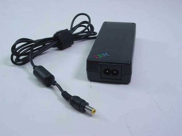 IBM 02K6746 AC Adapter — side/rear view showing IEC C7 AC inlet and yellow barrel-tip connector