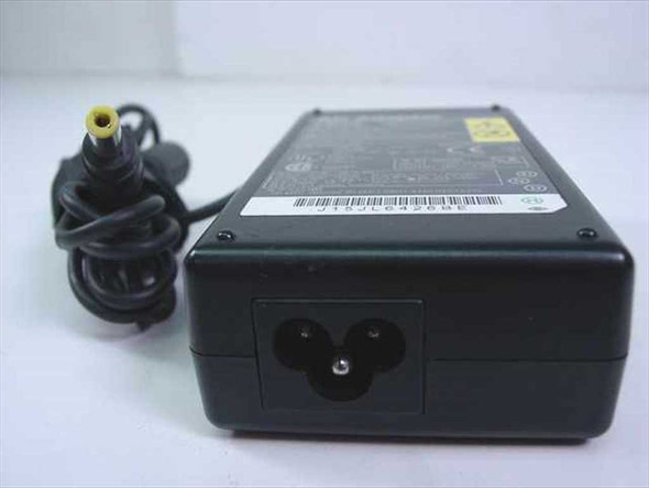 IBM 02K7006 AC Adapter — bottom/rear view showing AC inlet (IEC C5 cloverleaf) and yellow barrel output connector