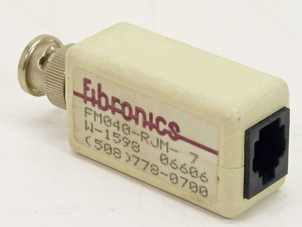 Fibronics FM040-RJM-7 RJ11 to BNC network adapter – front/side view showing RJ11 port and Fibronics label with model number W-1598
