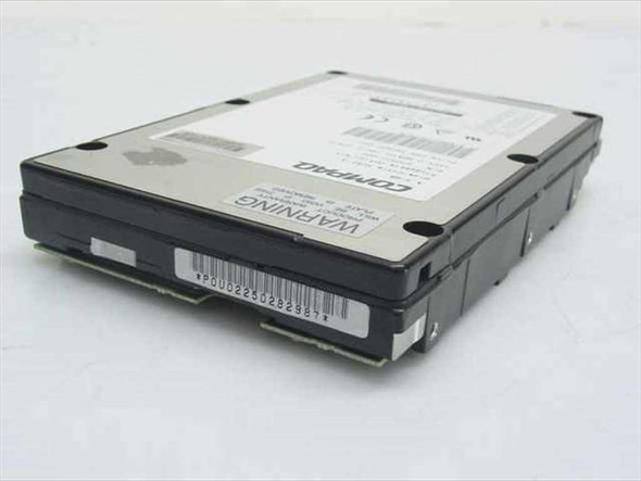 Fujitsu MAB3045SC SCSI hard drive bottom angled view showing Compaq label and barcode