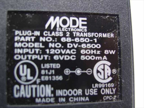 Mode Electronics DV-6500 label showing Part No. 68-650-1, 120VAC 60Hz 8W input, 6VDC 500mA output, UL and CSA marks