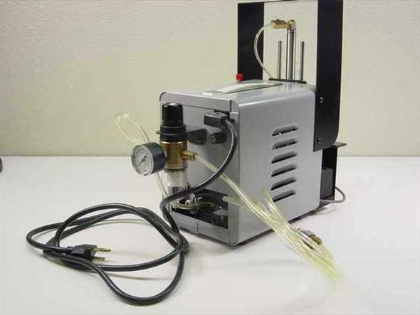 Ultramation OA-4 Pneumatic Linear Thruster — right side view showing silver compressor pump body, brass regulator/filter assembly, WIKA pressure gauge, and AC power cord