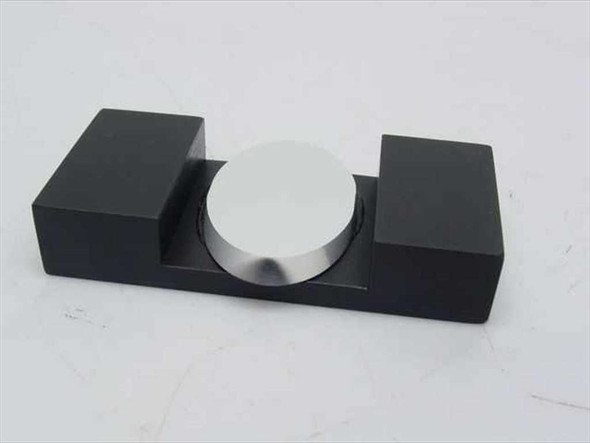 Spindler and Hoyer NL optical mirror fixture clamp – front view showing matte black U-cradle base with circular polished mirror disk seated in centered cutout