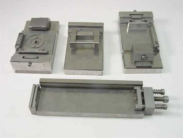 Lot of 4 FM precision machined IC test socket fixture jigs shown together on white background – overview