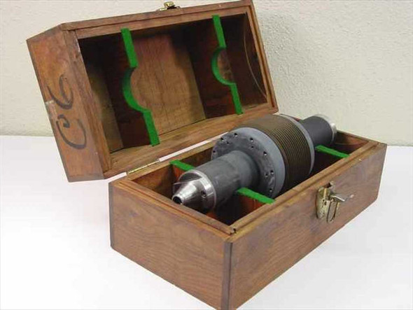 Cor-Bridge Inc 530012-6 Parting Tool Spindle in wood storage box showing spindle nose taper and multi-disc body — side view with lid open