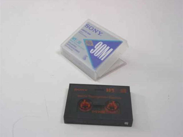 Sony DG90M DDS Data Cartridge shown with case open and bare tape cassette beside it